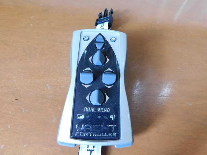 Slide: The Image of Remote control for 2003 Carver 444 Cockpit Motor Yacht, featuring dual band technology. - 22