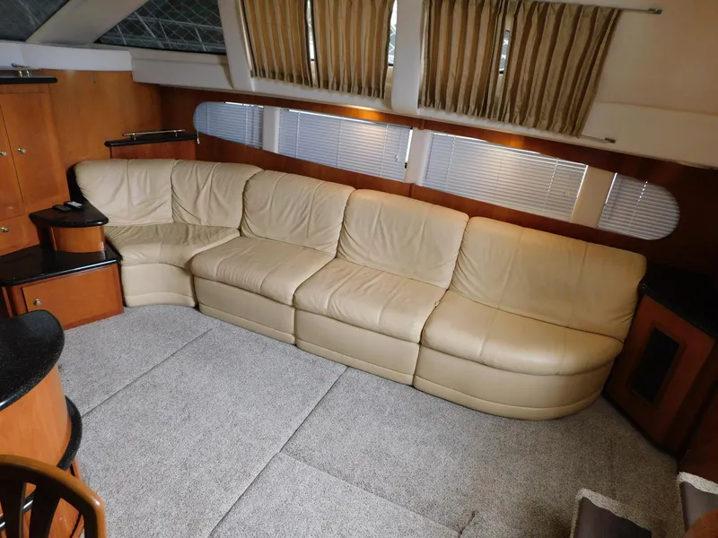 Slide: The Image of Luxurious interior of 2003 Carver 444 Cockpit Motor Yacht with beige leather sofa. - 29