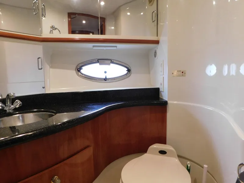 Slide: The Image of Luxurious bathroom in 2003 Carver 444 Cockpit Motor Yacht with sleek design and modern fixtures. - 32