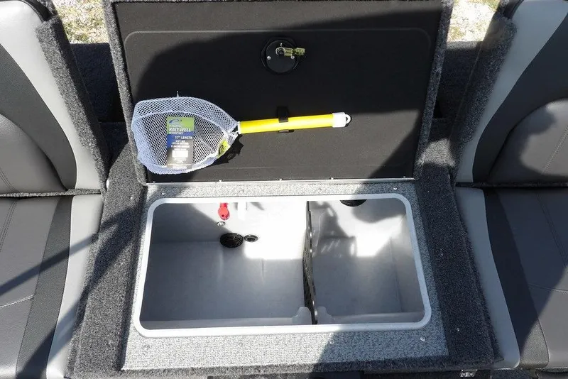 Slide: The Image of 2026 Lund 1875 Impact XS Sport boat interior with open storage compartment and fishing net. - 17