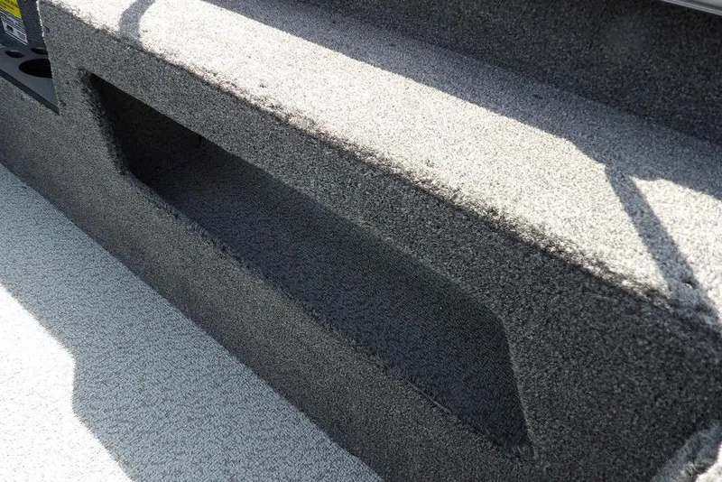 Slide: The Image of 2026 Lund 1875 Impact XS Sport boat interior with carpeted storage compartment. - 20