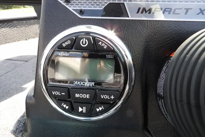 Slide: The Image of Control panel of 2026 Lund 1875 Impact XS Sport boat with Kicker audio system. - 24