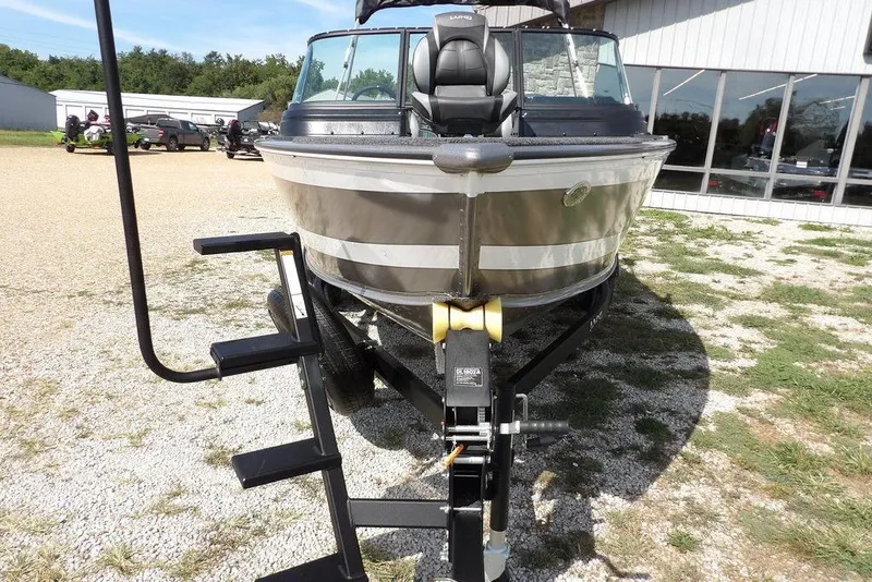 Slide: The Image of 2026 Lund 1875 Impact XS Sport boat on trailer, parked outdoors. - 3