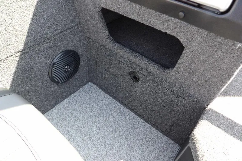 Slide: The Image of Interior of 2026 Lund 1875 Impact XS Sport boat with speaker and storage compartment. - 30