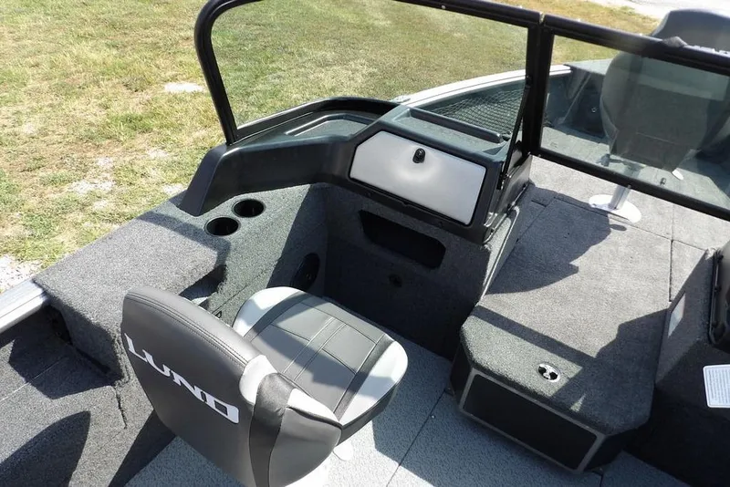 Slide: The Image of 2026 Lund 1875 Impact XS Sport boat interior with seating and storage compartments. - 31