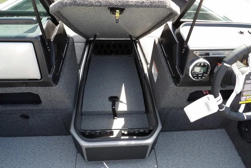 Slide: The Image of 2026 Lund 1875 Impact XS Sport boat interior with open storage compartment. - 39