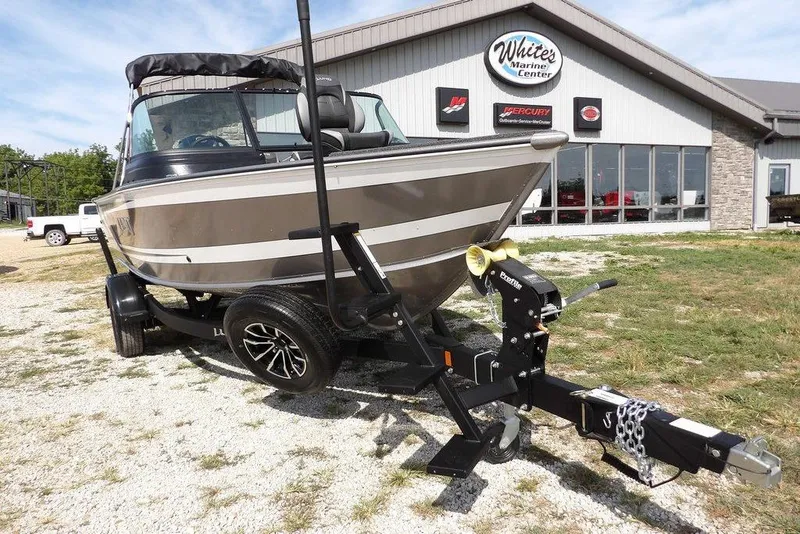 Slide: The Image of 2026 Lund 1875 Impact XS Sport boat on trailer at White's Marine Center. - 46