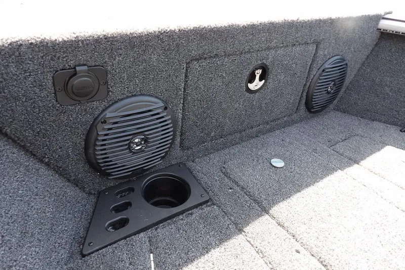 Slide: The Image of 2026 Lund 1875 Impact XS Sport boat interior with speakers and cup holder. - 47