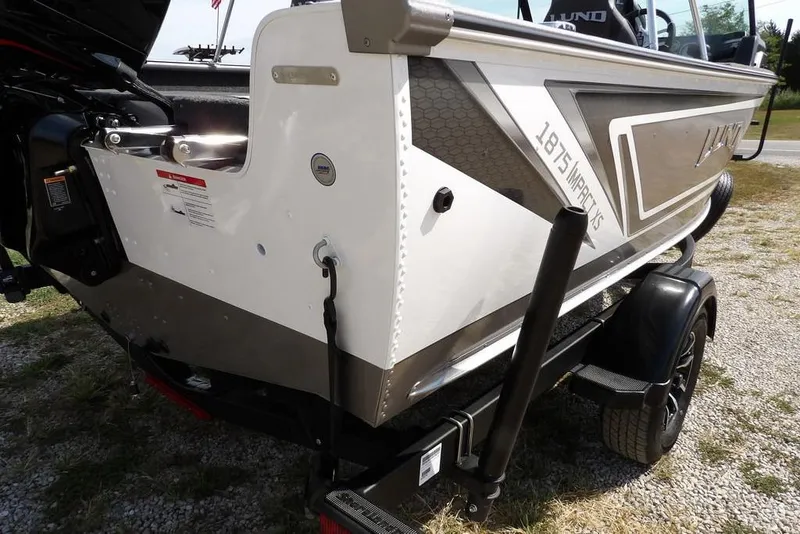 Slide: The Image of 2026 Lund 1875 Impact XS Sport boat on trailer, rear view, outdoors. - 49