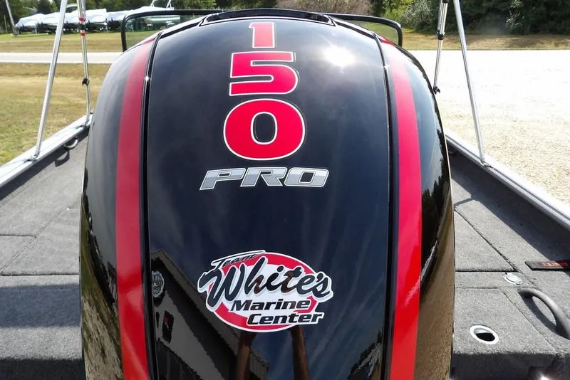 Slide: The Image of 2026 Lund 1875 Impact XS Sport boat with 150 Pro engine, White's Marine Center logo. - 53