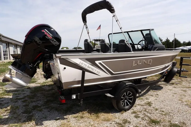 Slide: The Image of 2026 Lund 1875 Impact XS Sport boat with Mercury Pro XS engine on trailer. - 8