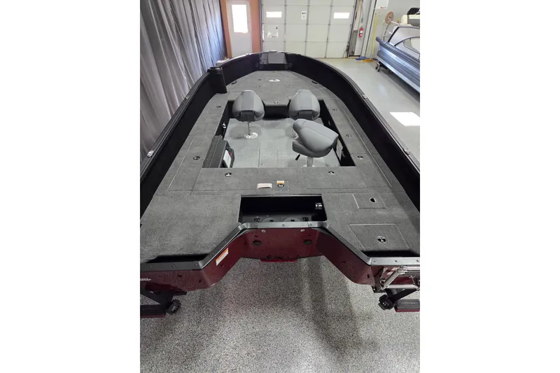 Slide: The Image of 2026 Alumacraft Competitor 185X Tiller boat interior with seating and spacious deck. - 11