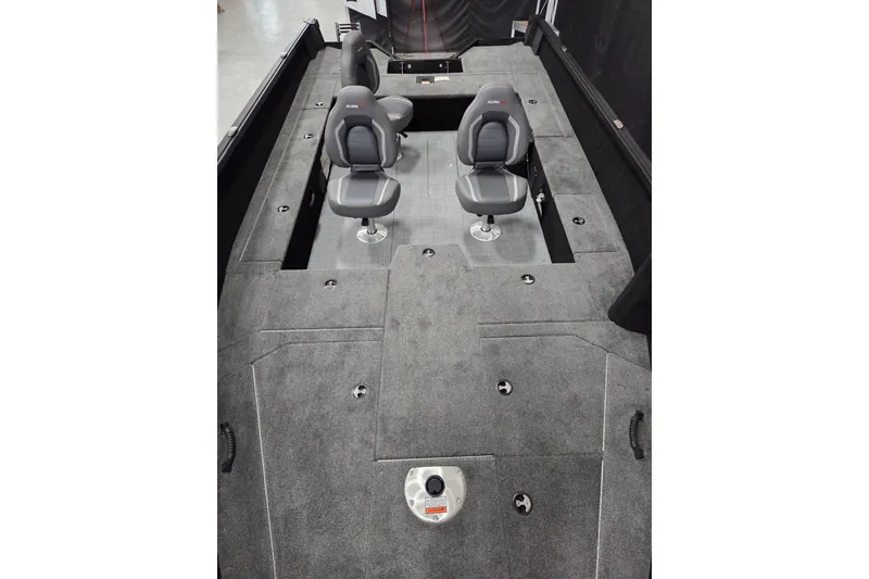 Slide: The Image of 2026 Alumacraft Competitor 185X Tiller interior with dual seats and spacious deck layout. - 5