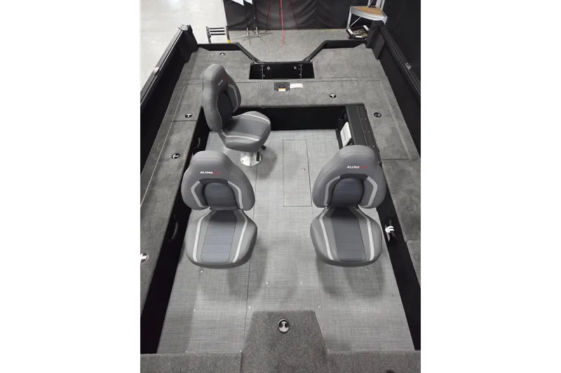 Slide: The Image of 2026 Alumacraft Competitor 185X Tiller interior with three gray seats and spacious layout. - 6