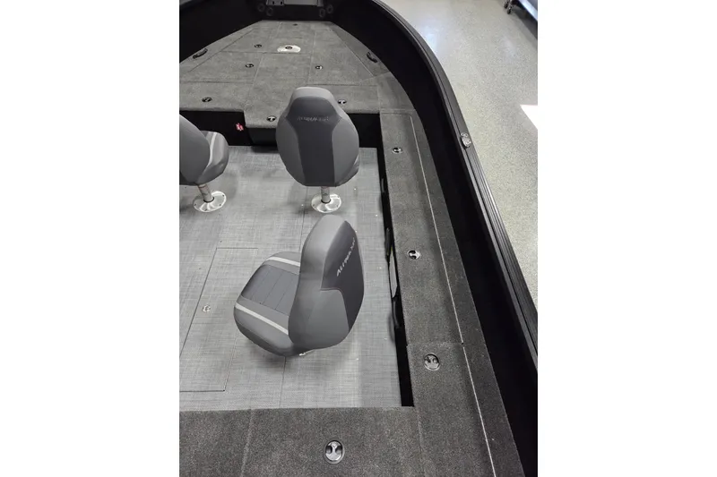 Slide: The Image of 2026 Alumacraft Competitor 185X Tiller boat interior with gray seating and spacious deck. - 9