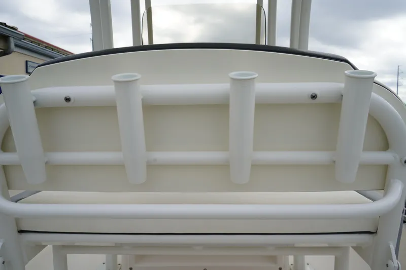 Slide: The Image of 2023 Robalo R222 Explorer boat rod holders on a sleek white frame. - 15