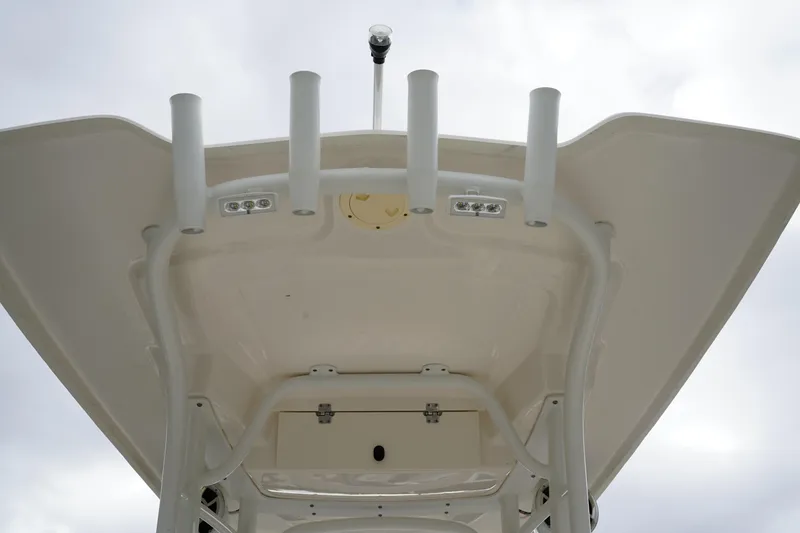 Slide: The Image of 2023 Robalo R222 Explorer boat top view with rod holders and lights. - 16