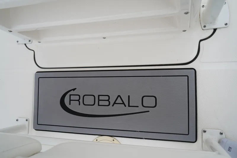Slide: The Image of 2023 Robalo R222 Explorer boat interior with branded mat. - 20