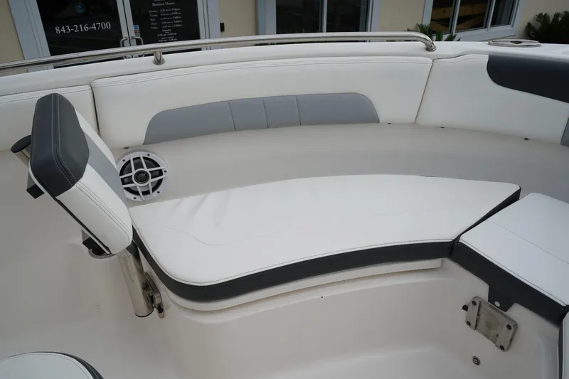 Slide: The Image of 2023 Robalo R222 Explorer boat interior with white and gray seating. - 24