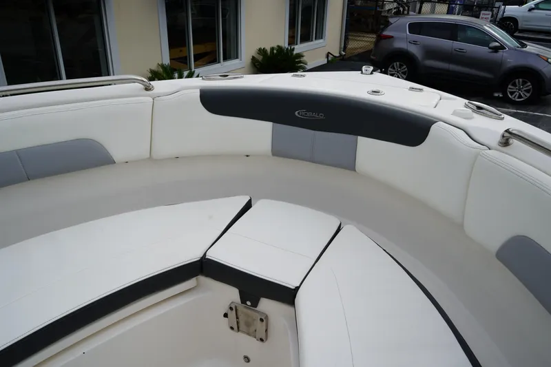 Slide: The Image of 2023 Robalo R222 Explorer boat interior with white and gray seating. - 25