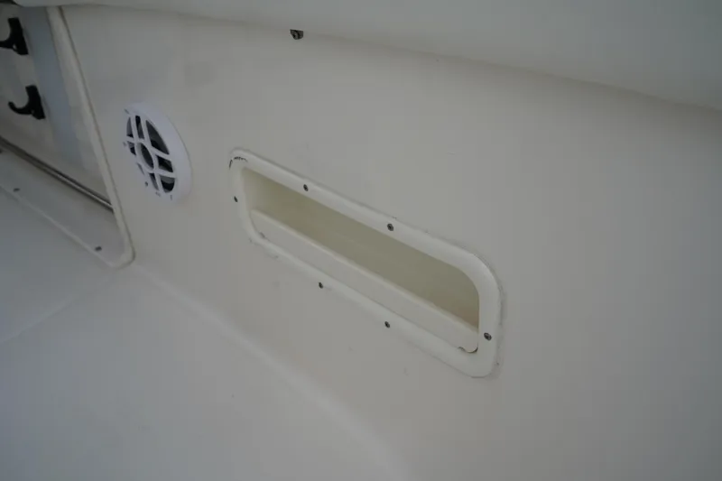 Slide: The Image of 2023 Robalo R222 Explorer interior detail with speaker and vent. - 28