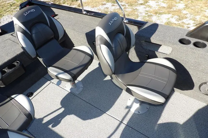 Slide: The Image of 2026 Lund 1875 Impact XS Sport boat interior with two cushioned seats. - 17