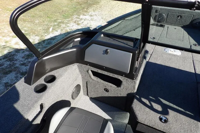 Slide: The Image of 2026 Lund 1875 Impact XS Sport boat interior with seating and storage compartments. - 24