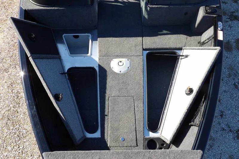 Slide: The Image of 2026 Lund 1875 Impact XS Sport boat interior with open storage compartments. - 32