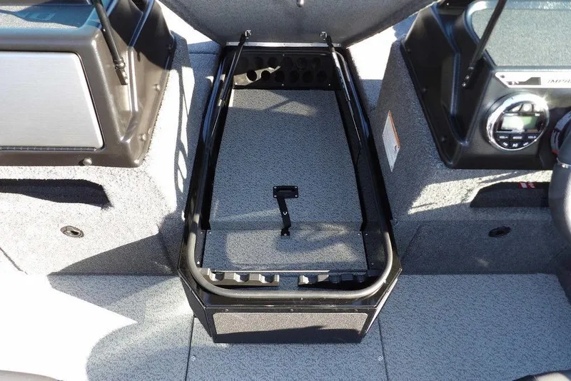 Slide: The Image of 2026 Lund 1875 Impact XS Sport boat interior with storage compartment open. - 35