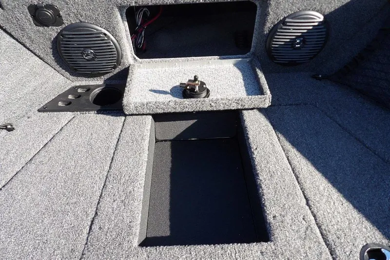 Slide: The Image of 2026 Lund 1875 Impact XS Sport boat interior with speakers and storage compartments. - 38