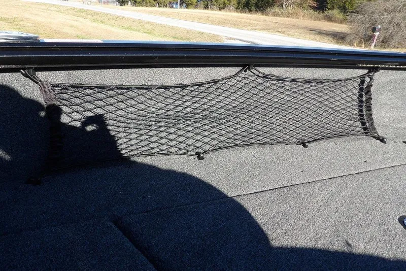 Slide: The Image of 2026 Lund 1875 Impact XS Sport boat interior with storage netting. - 39