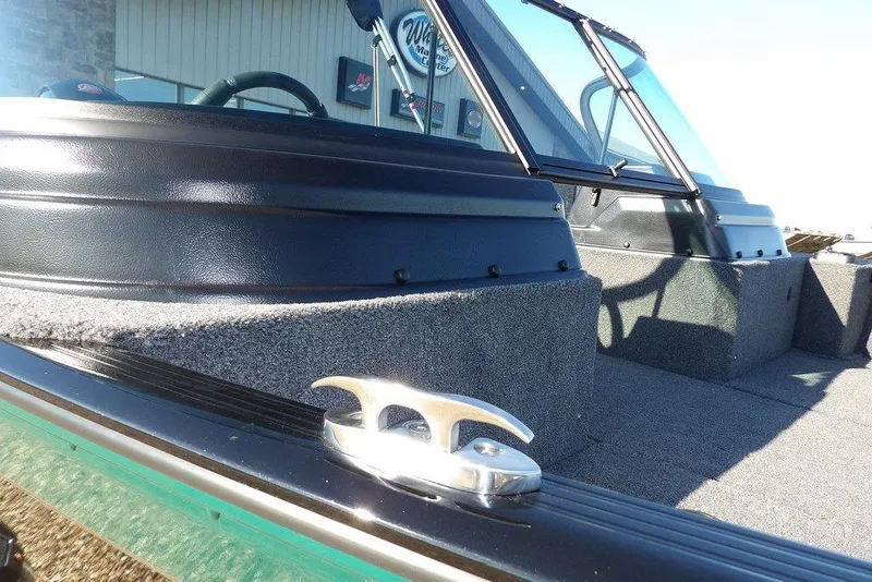 Slide: The Image of 2026 Lund 1875 Impact XS Sport boat, featuring sleek design and durable construction. - 49