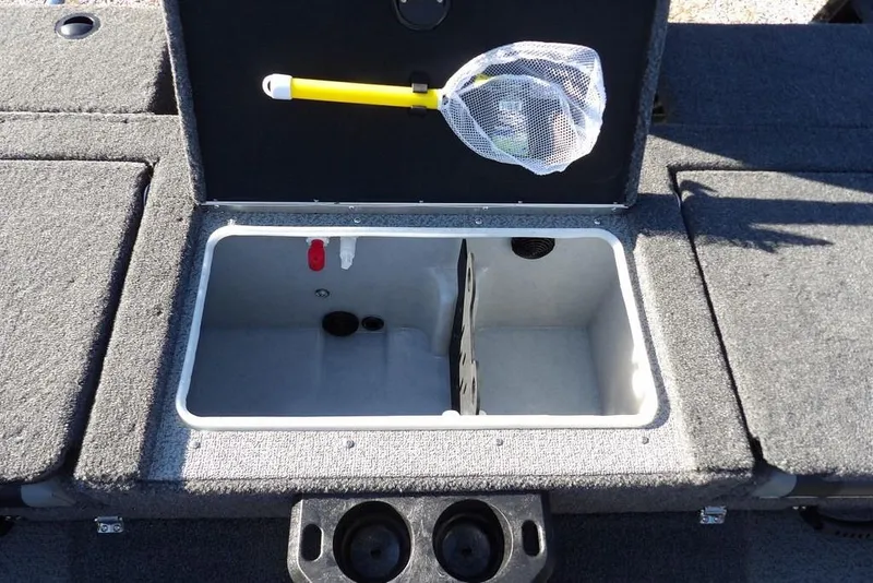 Slide: The Image of 2026 Lund 1875 Impact XS Sport boat storage compartment with net and cup holders. - 7