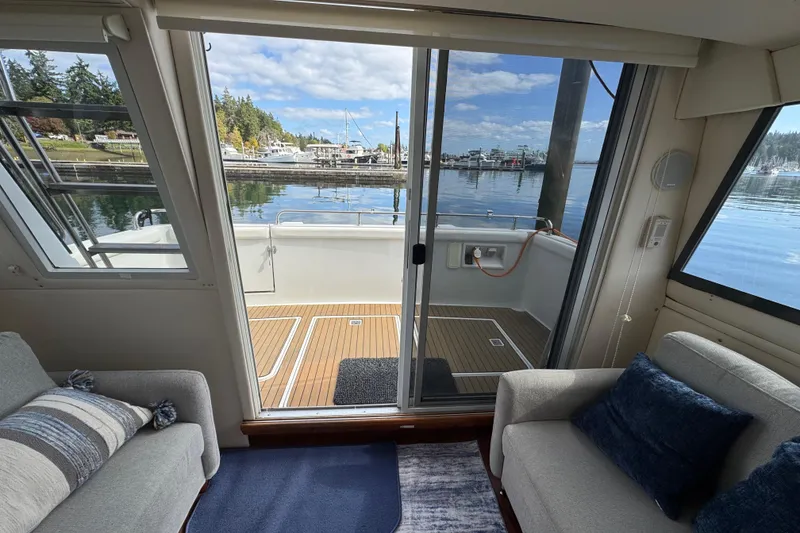 Slide: The Image of Interior view of 1996 Carver 370 Voyager yacht with marina backdrop. - 10