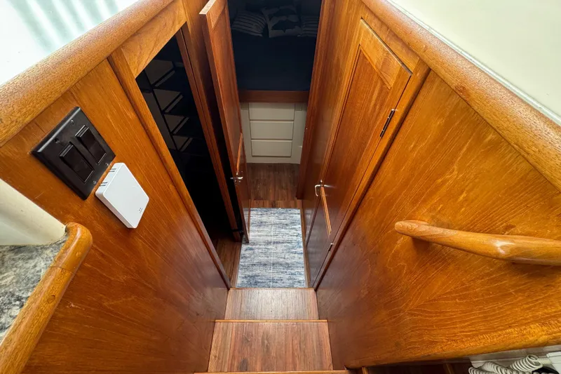 Slide: The Image of Interior of 1996 Carver 370 Voyager yacht with wooden stairs and cabin entrance. - 18