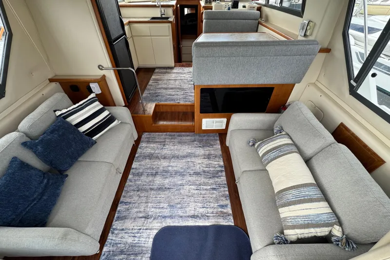Slide: The Image of Interior of 1996 Carver 370 Voyager yacht with cozy seating and modern decor. - 2