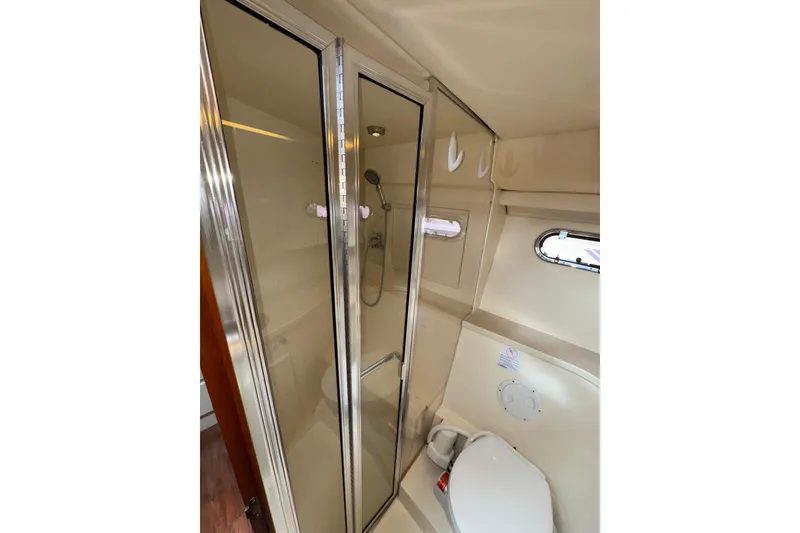 Slide: The Image of Bathroom interior of 1996 Carver 370 Voyager yacht with shower and toilet. - 27