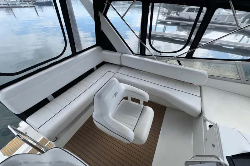 Slide: The Image of 1996 Carver 370 Voyager interior with white seating and panoramic windows. - 30