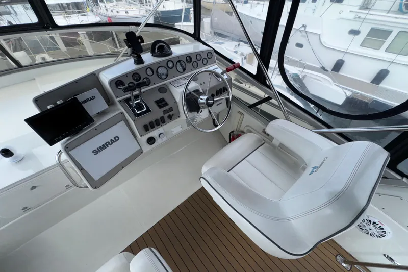 Slide: The Image of Helm of 1996 Carver 370 Voyager with Simrad navigation system and captain's chair. - 31