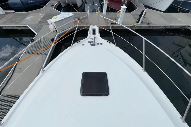 Slide: The Image of Bow view of 1996 Carver 370 Voyager yacht docked at marina. - 41