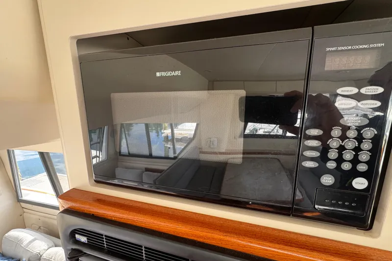 Slide: The Image of Frigidaire microwave in 1996 Carver 370 Voyager yacht interior, featuring smart sensor cooking system. - 50