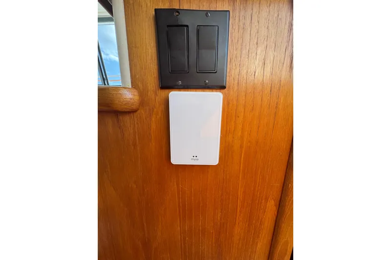 Slide: The Image of Light switch and device on wooden panel in 1996 Carver 370 Voyager boat. - 51