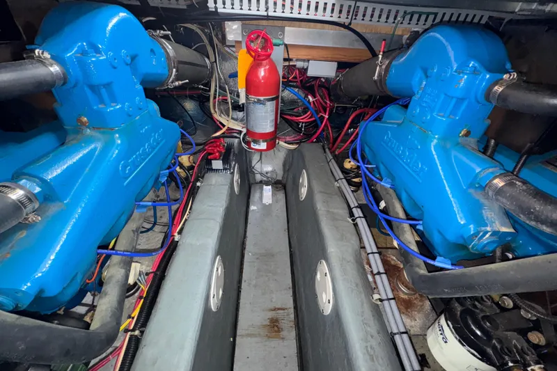 Slide: The Image of Engine room of a 1996 Carver 370 Voyager with blue Crusader engines. - 53