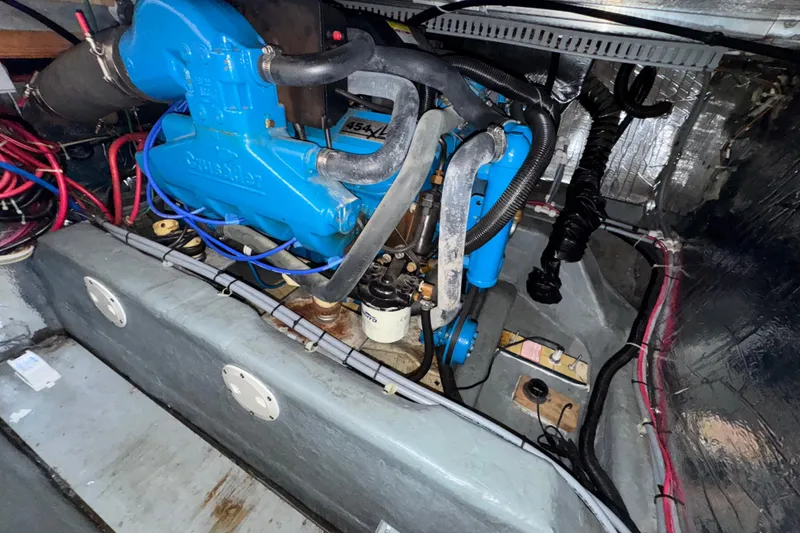 Slide: The Image of Engine compartment of a 1996 Carver 370 Voyager with blue engine components. - 55