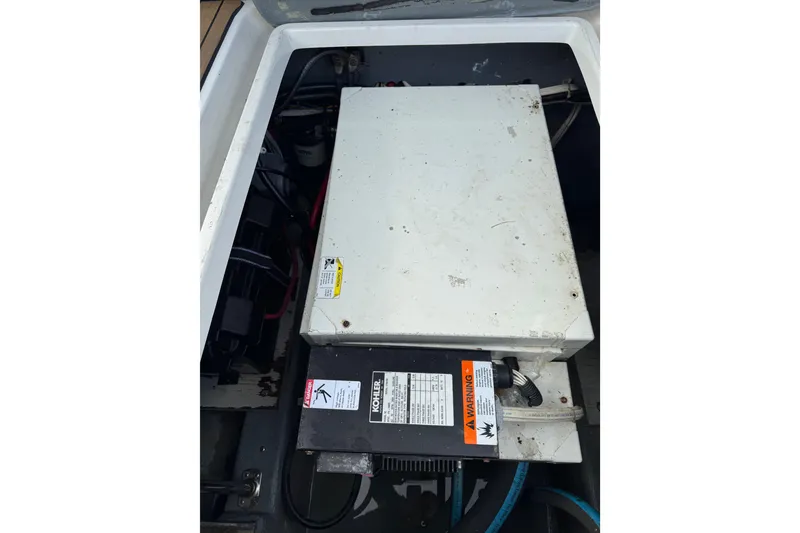 Slide: The Image of Engine compartment of a 1996 Carver 370 Voyager boat, featuring a Kohler generator. - 59