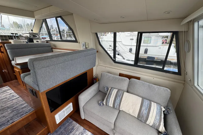 Slide: The Image of Interior of 1996 Carver 370 Voyager yacht with seating and helm station. - 9
