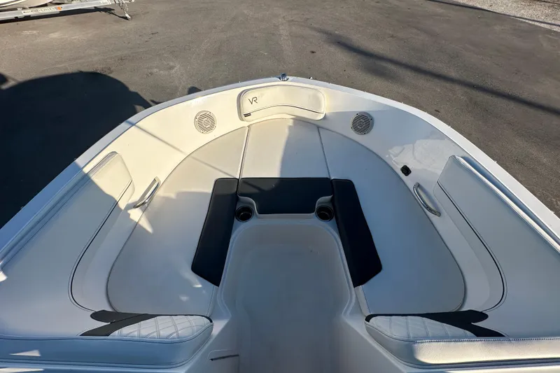 Slide: The Image of 2022 Bayliner VR5 Bowrider OB with spacious seating and sleek design under a sunny sky. - 49