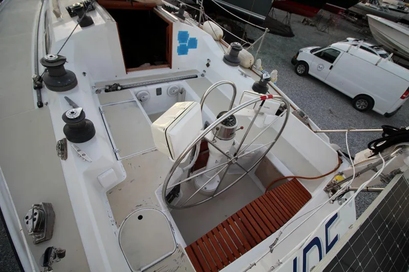 Slide: The Image of Cockpit of 1981 Ericson 36 sailboat with steering wheel and winches. - 15