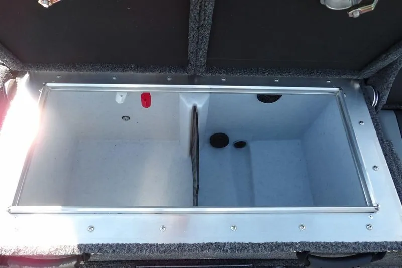 Slide: The Image of 2026 Lund 1875 Pro-V Bass XS livewell compartment, open and empty, with dual sections. - 17