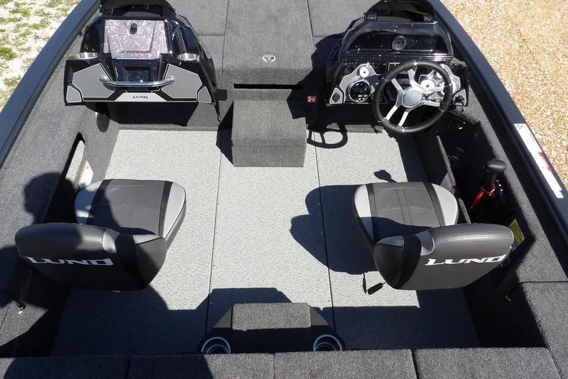 Slide: The Image of 2026 Lund 1875 Pro-V Bass XS boat interior with dual seats and steering console. - 20